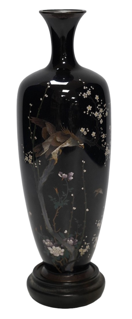 A Japanese cloisonné enamel ‘eagle’ vase, signed to base, on hardwood stand, 27cm total height. Condition - slight damage